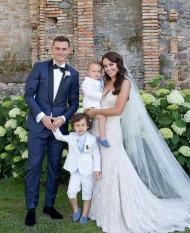 Polly Parsons with her husband Thomas Vermaelen and kids at their wedding in Italy.